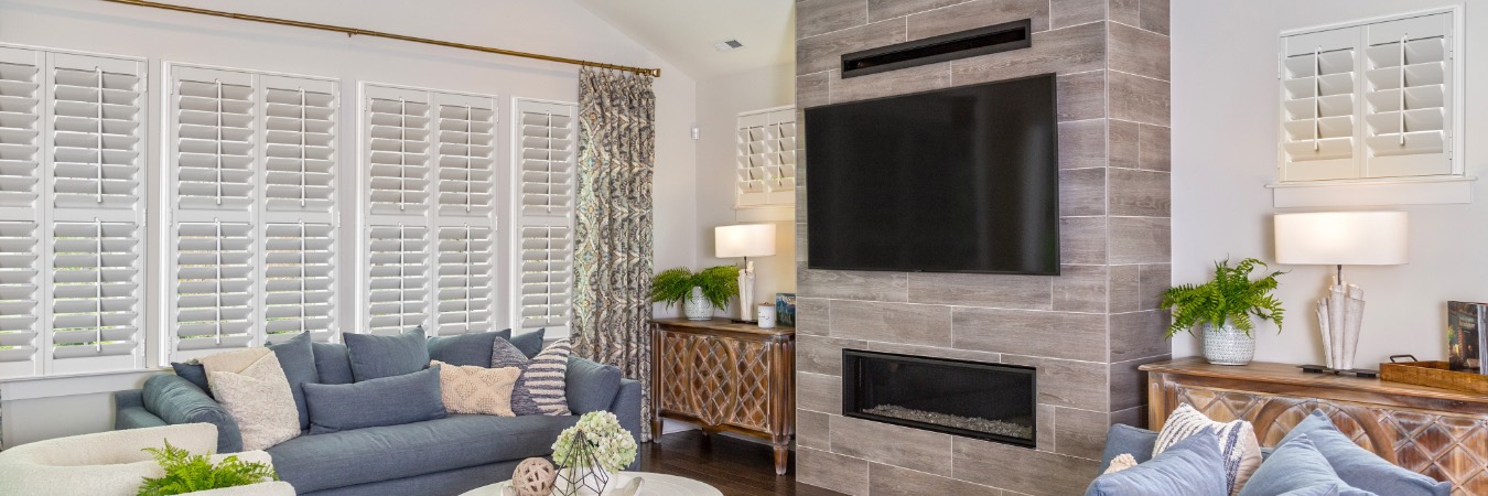 Plantation shutters in Holley family room with fireplace