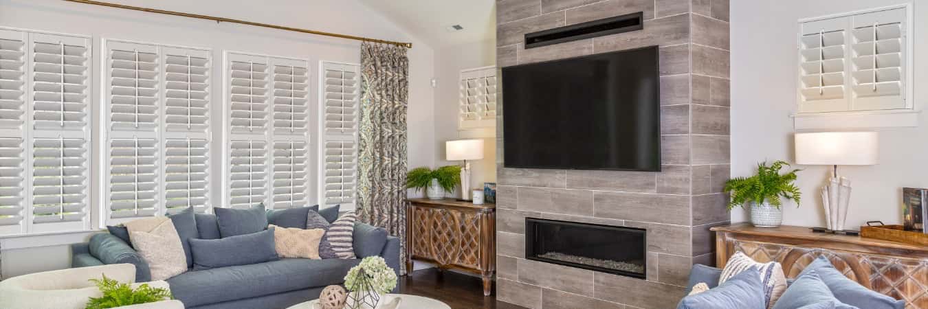 Plantation shutters in Callaway family room with fireplace