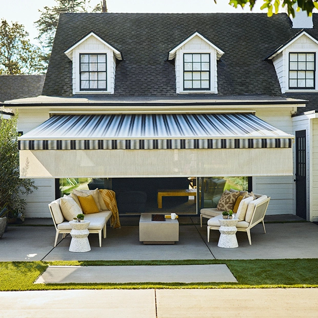 Striped awning over a home patio
