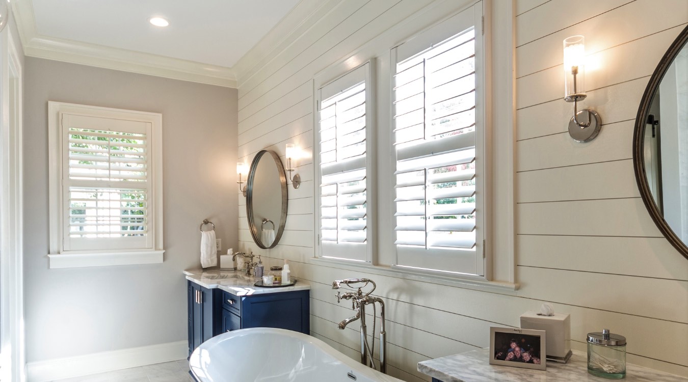 Destin bathroom with white plantation shutters.