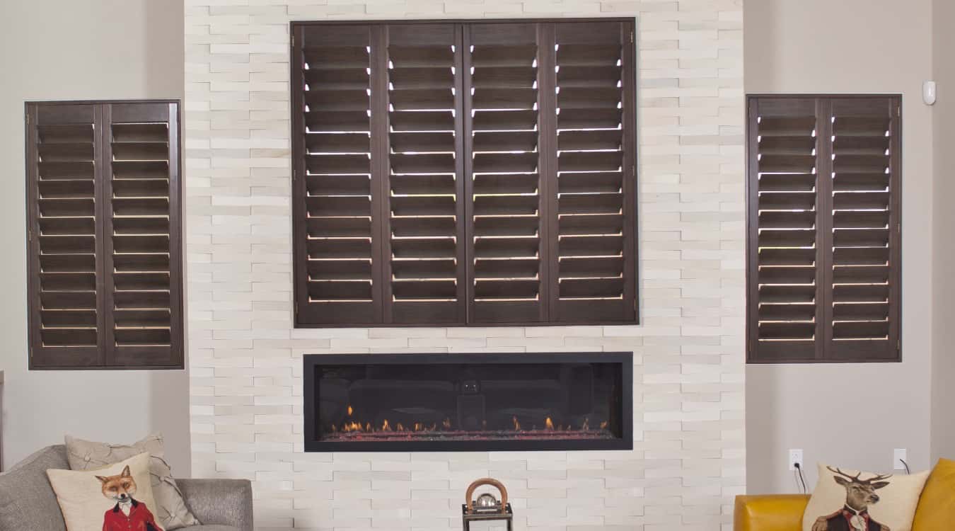 Ovation shutters in living room with fireplace