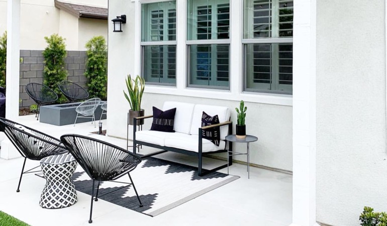 Spending a little time weeding and mulching can help give you an outside oasis. An outside patio with plantation shutters