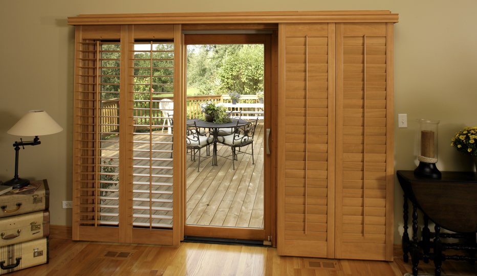 Destin Patio Door Shutter Styles Sunburst Shutters Bypass Wood Patio Door Shutters In A Destin Living Room