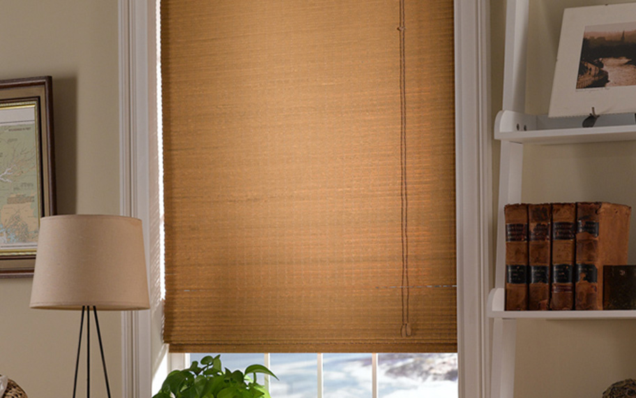 Add a touch of nature to your decor with woven fiber shades in Destin. Tan woven fiber shades in a living room