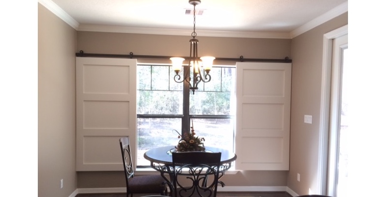 Barn doors open horizontally with slides instead of cords. Destin barn door shutters