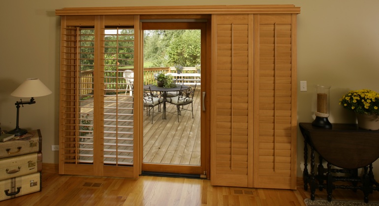 Theme your wood to create a transition from inside to outside. Destin wood shutter sliding door