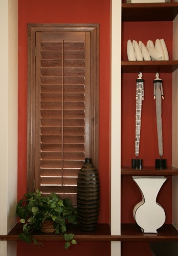 You can even match your wood shutters with shelving. Destin wood shutter shelving