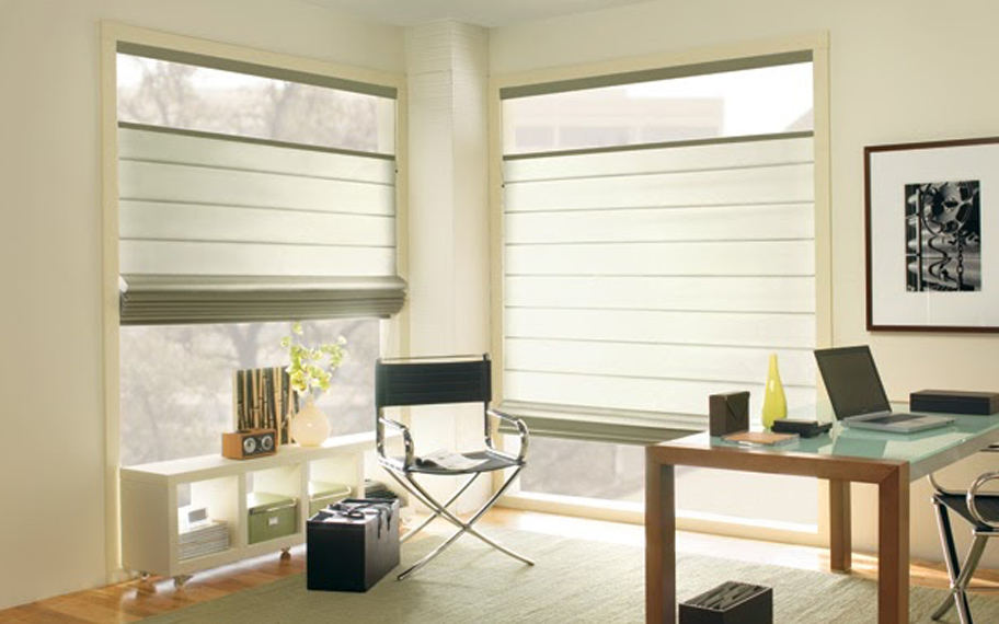 Upgrade your windows with stylish window shades or shutters in Destin. Stylish sheer shades in the corner of a modern office.