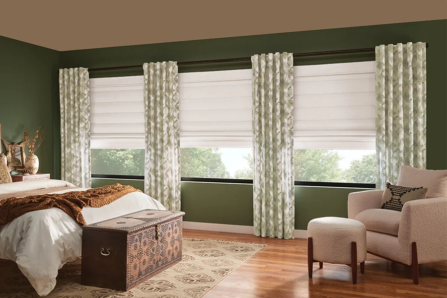 Green drapes and white shades on bedroom windows