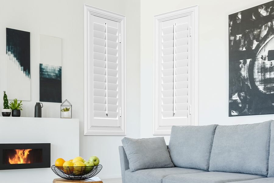 White Polywood shutters add character and class in Destin. White polywood shutters in a corner of a modern living room.